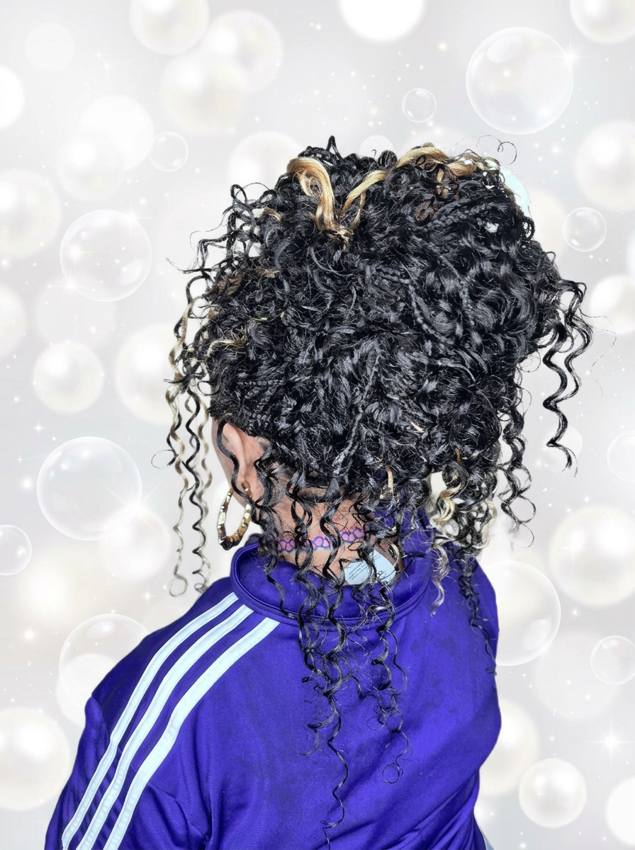 Small French curl braids styled into an updo